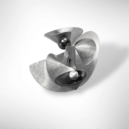 VOLUME Dress Up Your Outerwear with this Statement Brooch